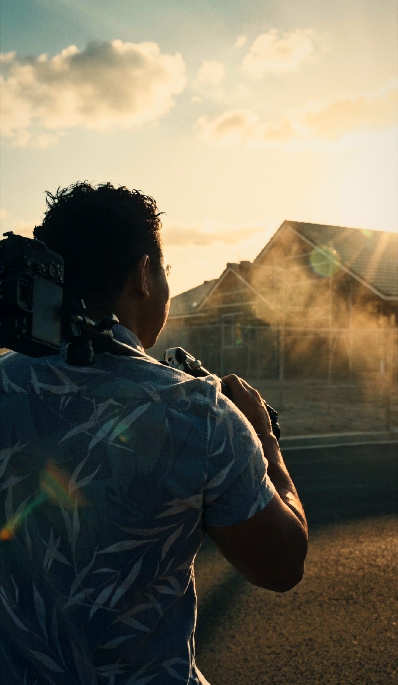 Jeremiah Cortez photographing a Central Valley home at golden hour