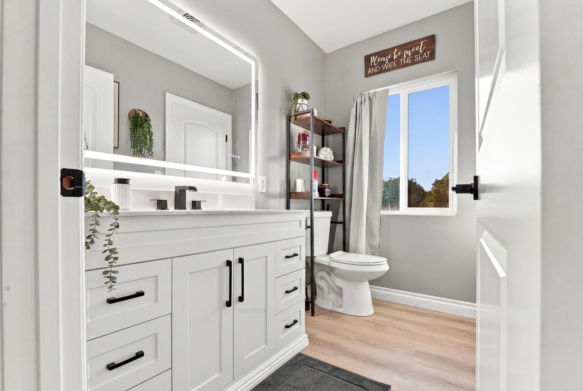 Bright bathroom with vanity and natural light — Lindsay real estate photography, California