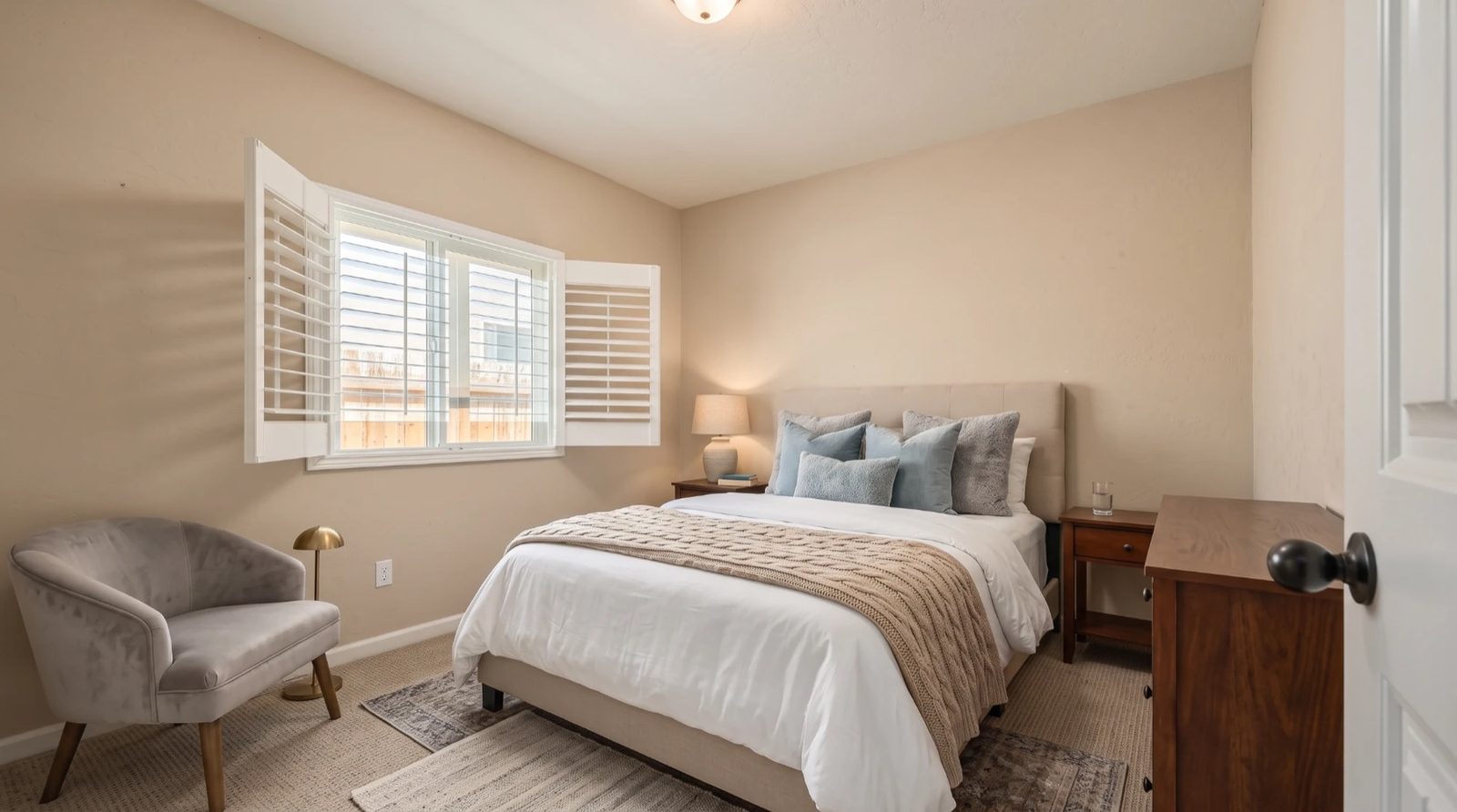 Virtually staged bedroom with plantation shutters — 4842 W Payson Ave, Visalia, California