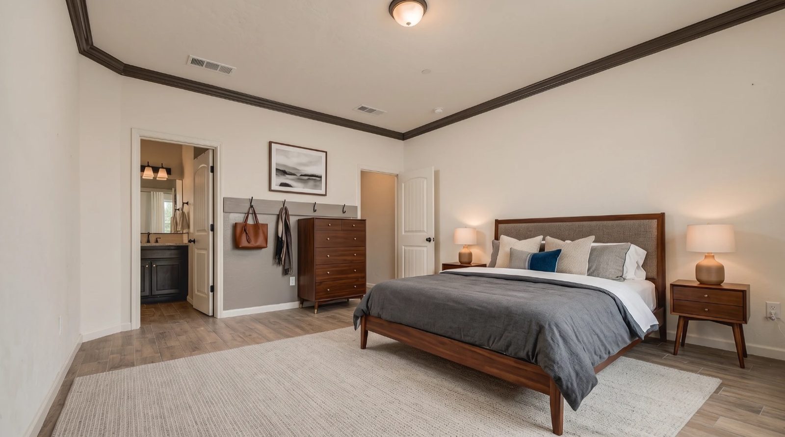 Virtually staged bedroom with walnut furniture and area rug — 4842 W Payson Ave, Visalia, California